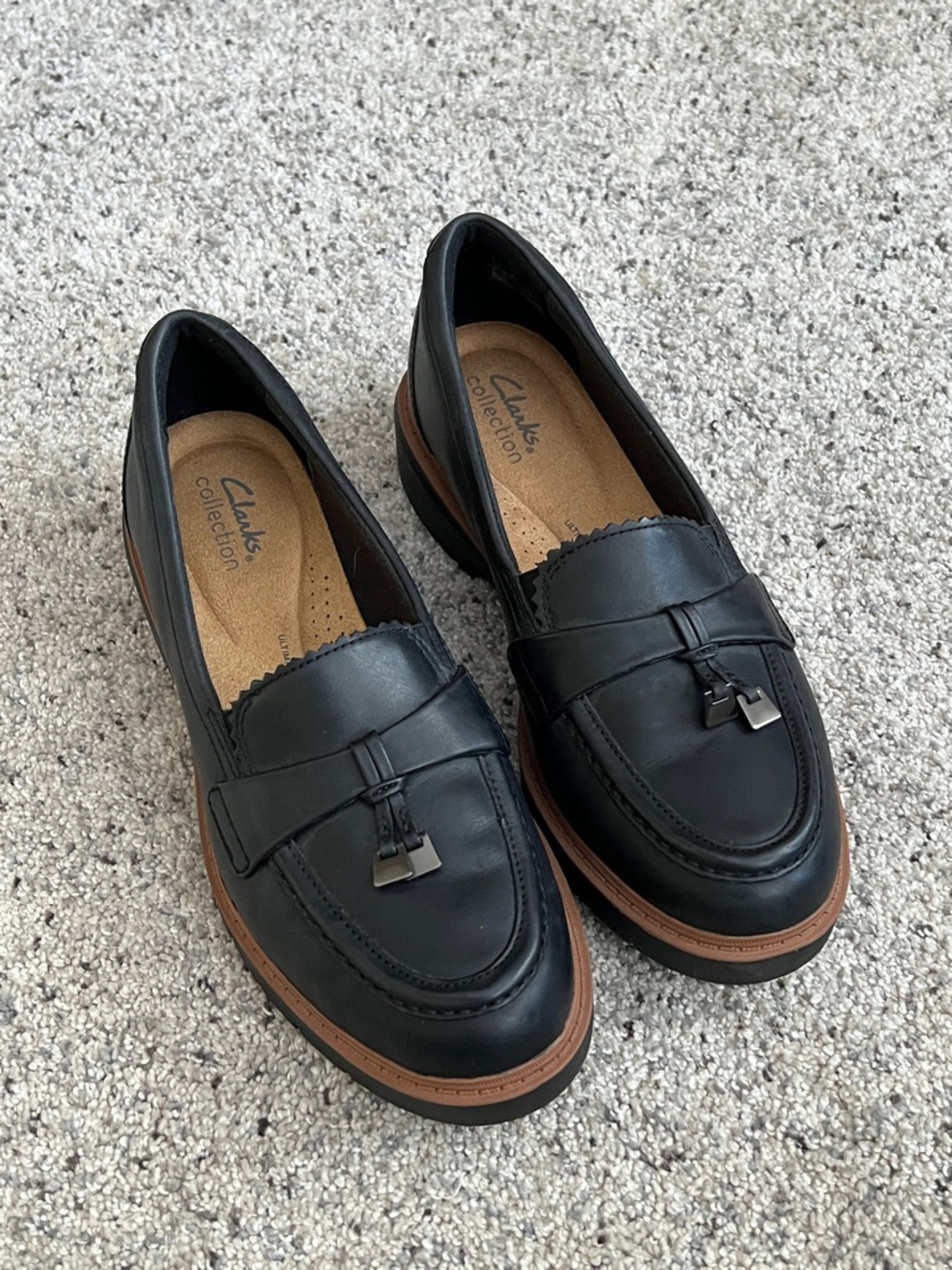Clarks Westlynn Bella Black Leather Tassel Loafers with Brown Trim